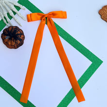 Load image into Gallery viewer, Long Tailed Orange Ribbon Bow
